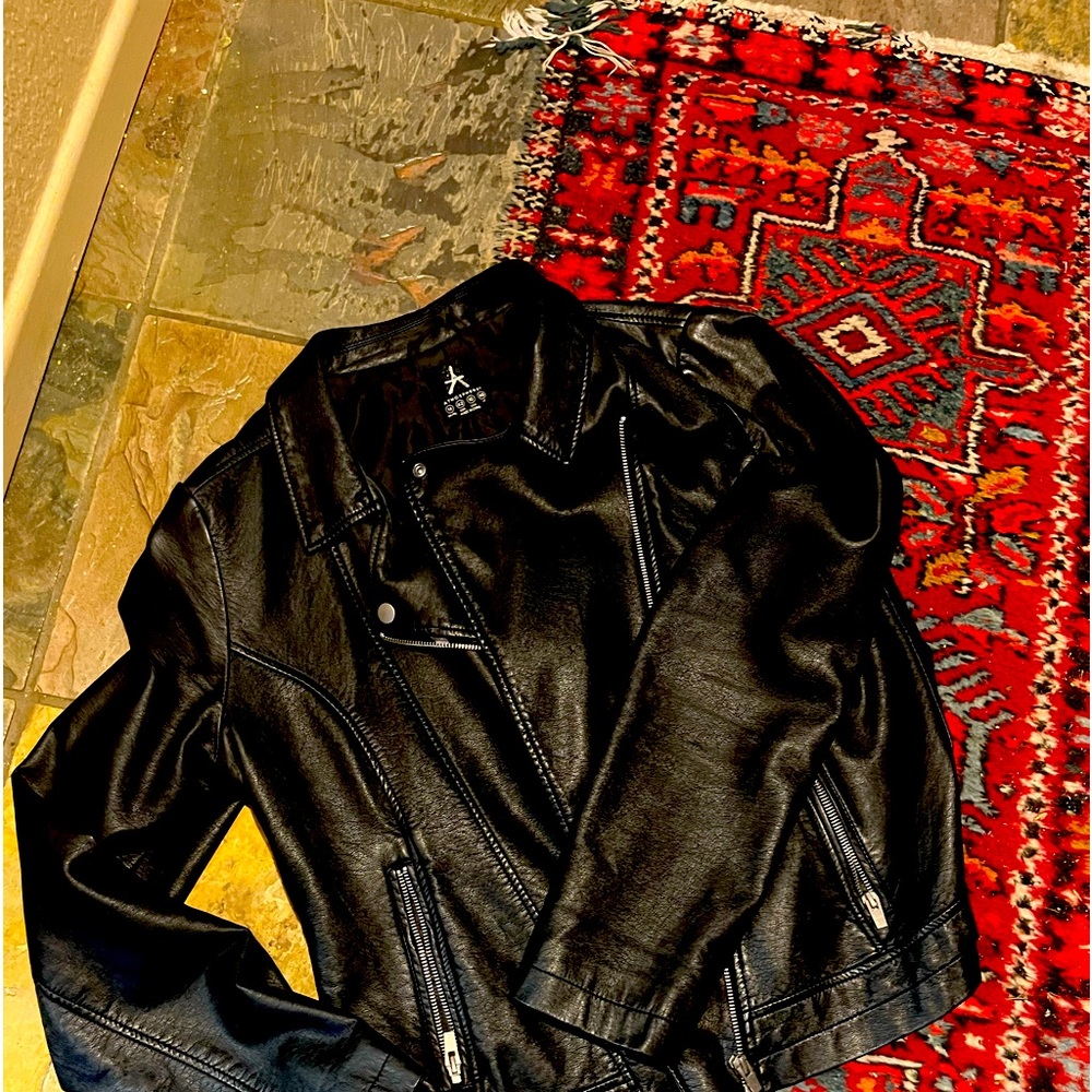Black faux leather jacket .